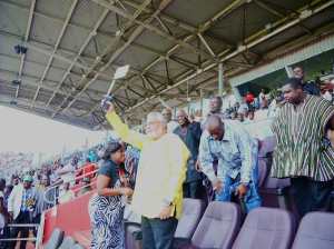 The former President waves the national flag in support of the Stars